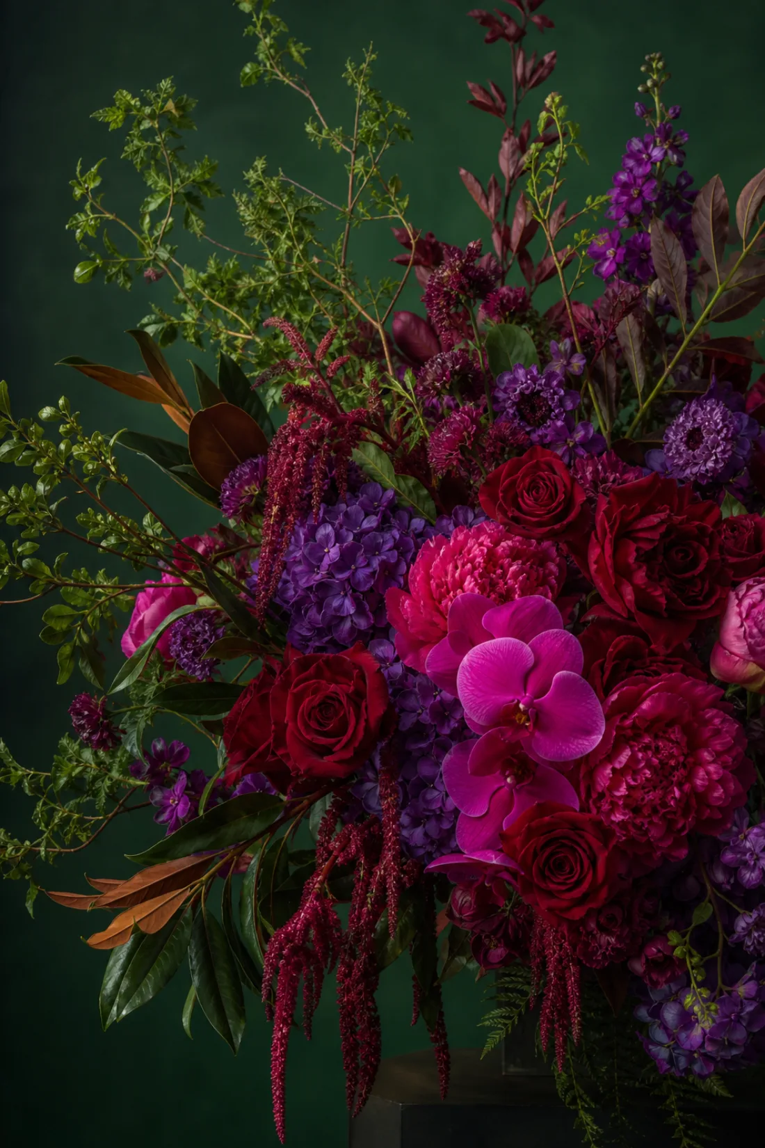 An oversized editorial bouquet with dramatic green foliage